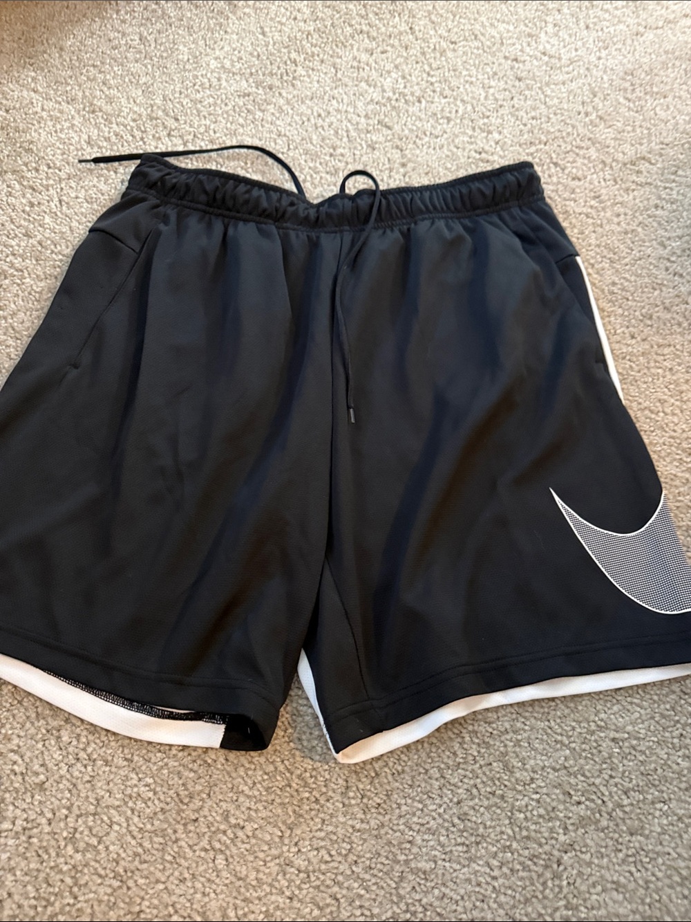 Nike Black Athletic Shorts with White Swoosh Accent